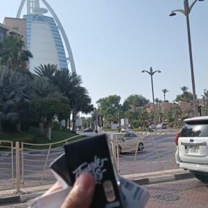 Disposable vape products held in front of Burj Al Arab in Dubai – KingPlugDubai bulk order offer